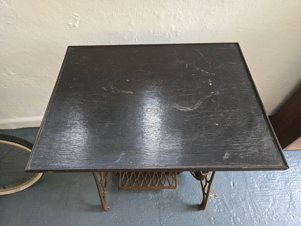 Singer sewing machine base. Table